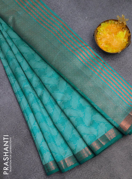 Semi raw silk saree teal blue shade with allover prints and copper zari woven border