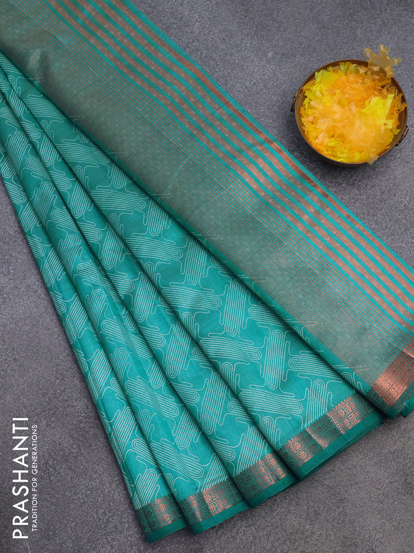 Semi raw silk saree teal blue shade with allover prints and copper zari woven border