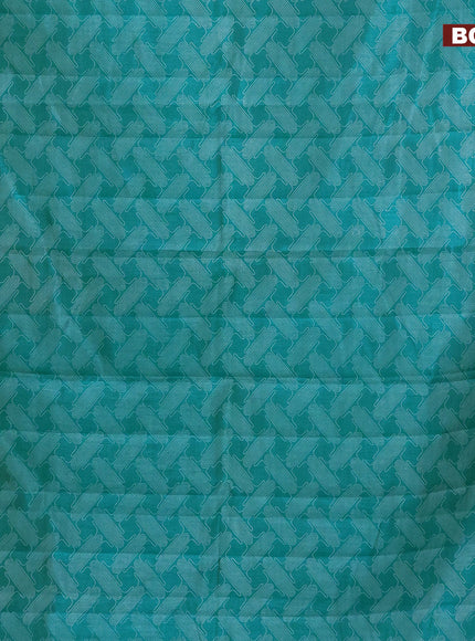 Semi raw silk saree teal blue shade with allover prints and copper zari woven border