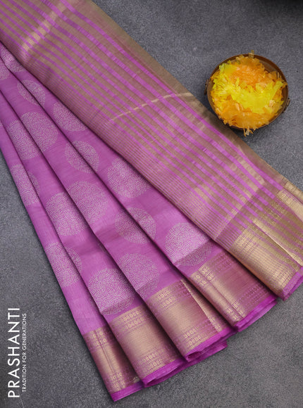 Semi raw silk saree lavender shade with butta prints and zari woven border