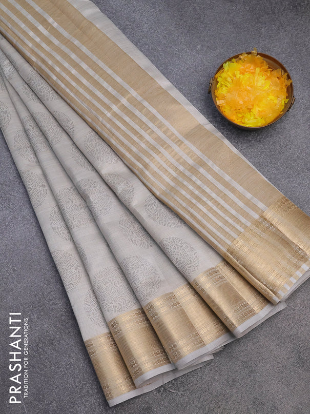 Semi raw silk saree pastel grey with butta prints and zari woven border