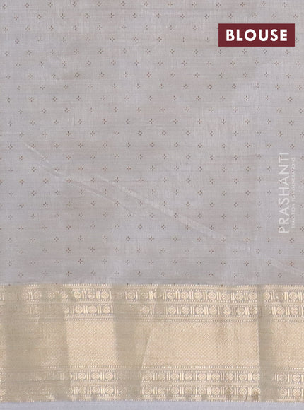 Semi raw silk saree pastel grey with butta prints and zari woven border