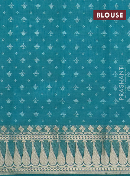 Semi raw silk saree teal green with floral butta prints and zari woven border