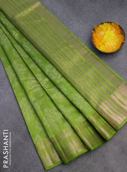 Semi raw silk saree light green with floral butta prints and zari woven border