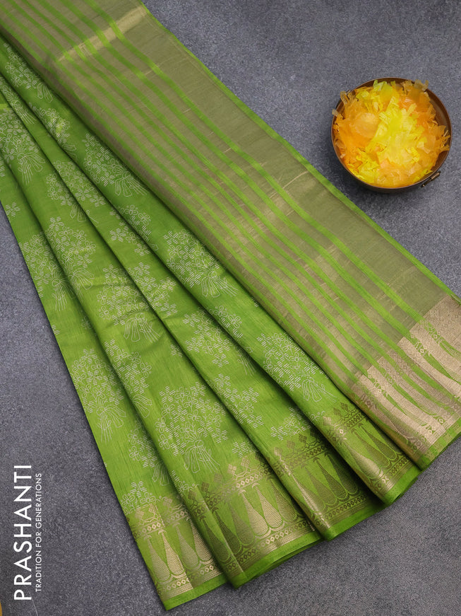 Semi raw silk saree light green with floral butta prints and zari woven border