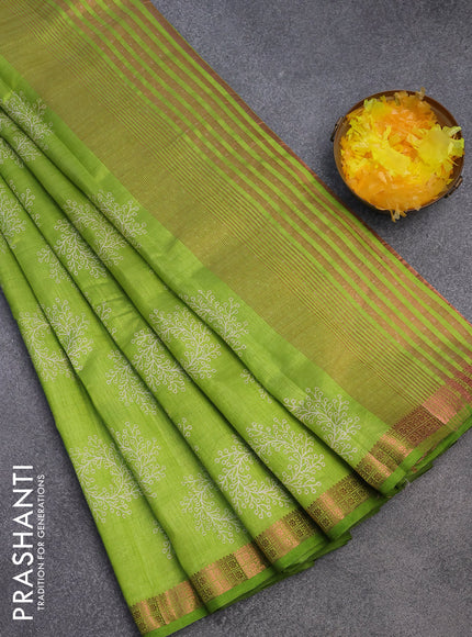 Semi raw silk saree light green with butta prints and copper zari woven border