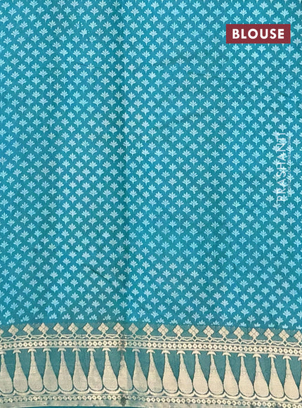 Semi raw silk saree teal green with butta prints and zari woven border