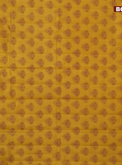 Semi raw silk saree mustard yellow with butta prints and zari woven border