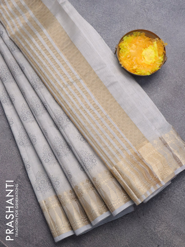 Semi raw silk saree pastel grey with butta prints and zari woven border