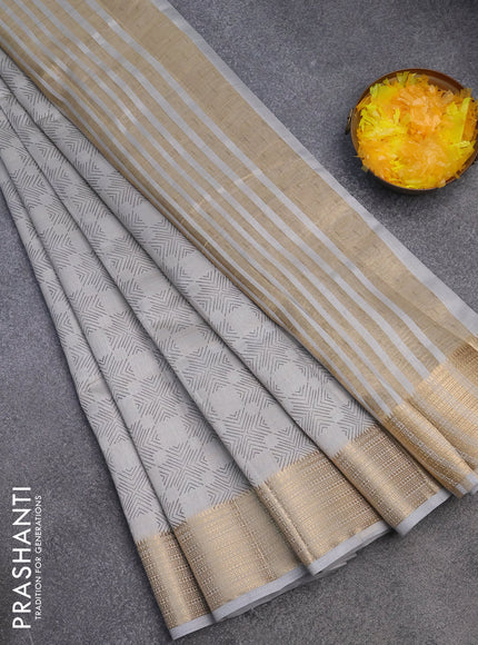 Semi raw silk saree pastel grey with allover prints and zari woven border