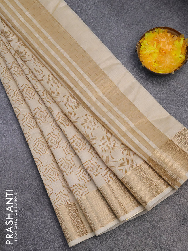 Semi raw silk saree cream with allover prints and zari woven border