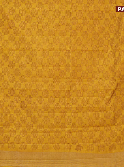 Semi raw silk saree mustrad yellow with allover prints and zari woven border