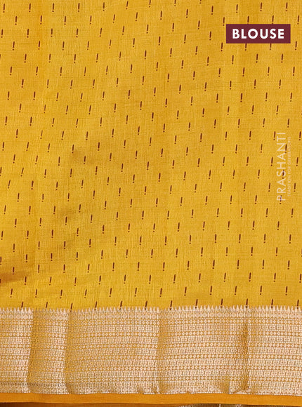 Semi raw silk saree mustrad yellow with allover prints and zari woven border