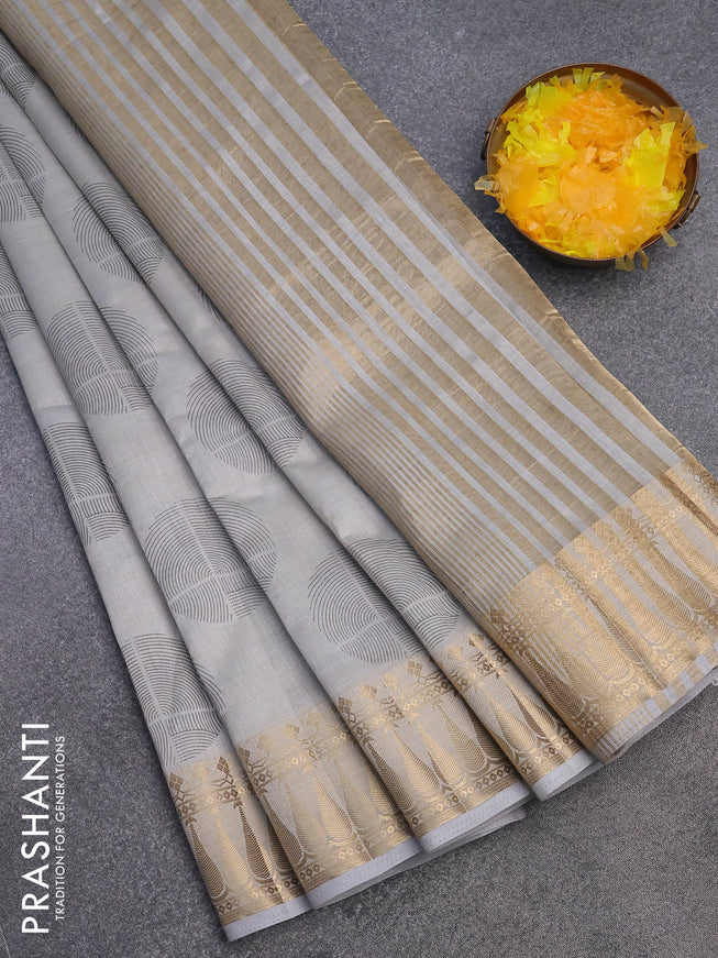 Semi raw silk saree pastel grey with butta prints and zari woven border