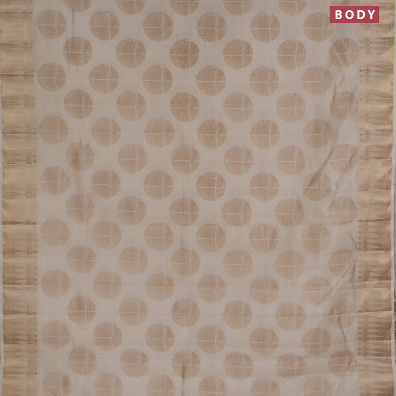 Semi raw silk saree cream with butta prints and zari woven border