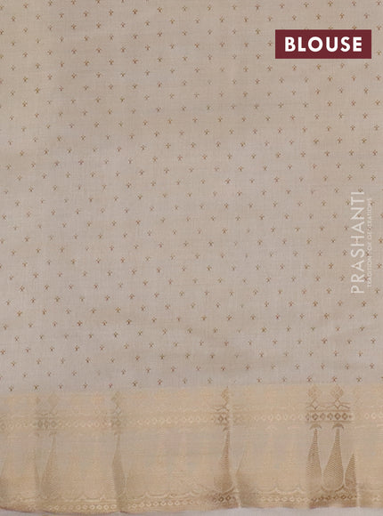 Semi raw silk saree cream with butta prints and zari woven border