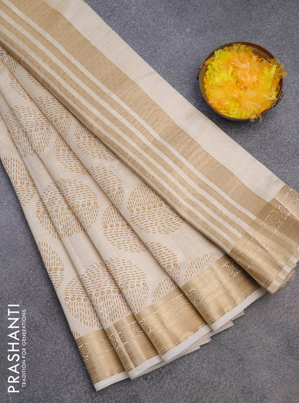 Semi raw silk saree cream with butta prints and zari woven border