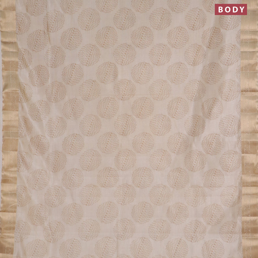 Semi raw silk saree cream with butta prints and zari woven border