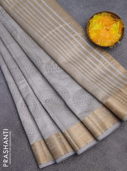 Semi raw silk saree pastel grey with butta prints and zari woven border