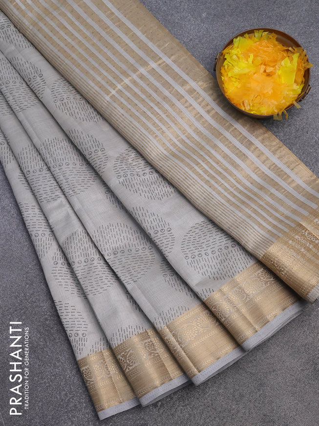 Semi raw silk saree pastel grey with butta prints and zari woven border