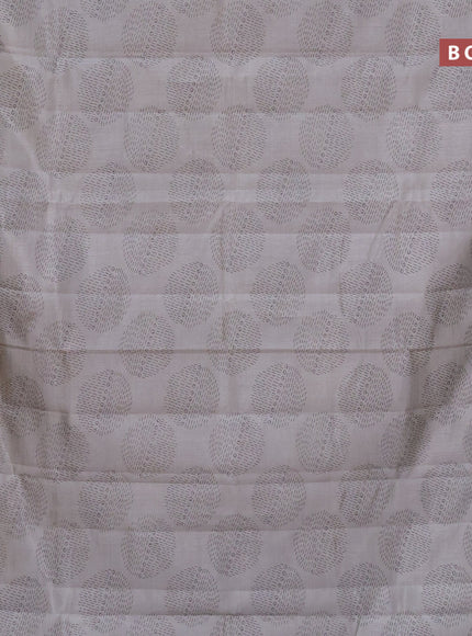 Semi raw silk saree pastel grey with butta prints and zari woven border