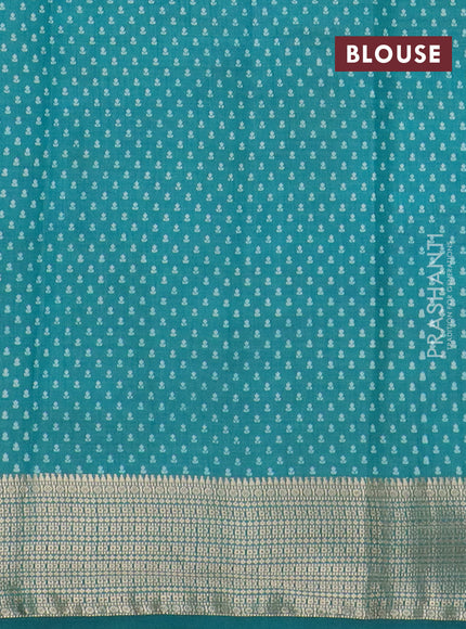 Semi raw silk saree teal green shade with floral butta prints and zari woven border