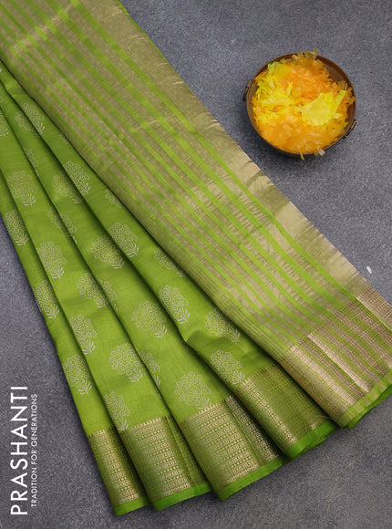 Semi raw silk saree light green with floral butta prints and zari woven border