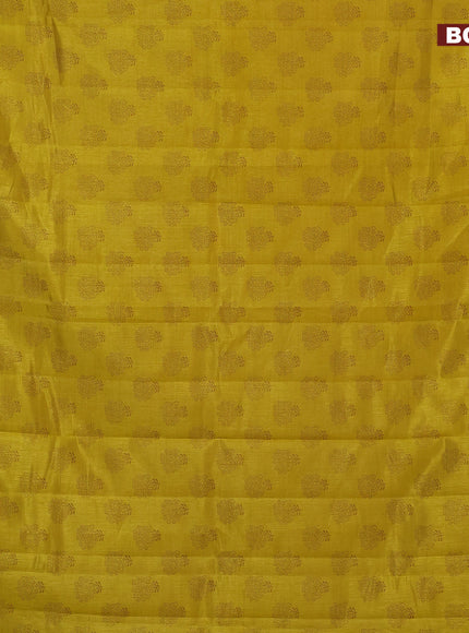 Semi raw silk saree yellow with floral butta prints and zari woven border