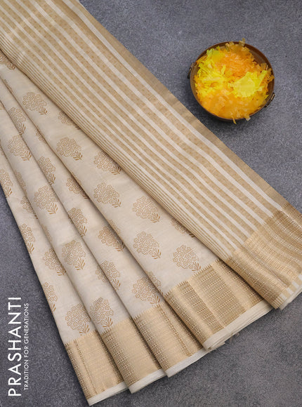 Semi raw silk saree cream with floral butta prints and zari woven border