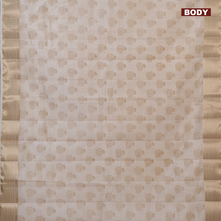 Semi raw silk saree cream with floral butta prints and zari woven border