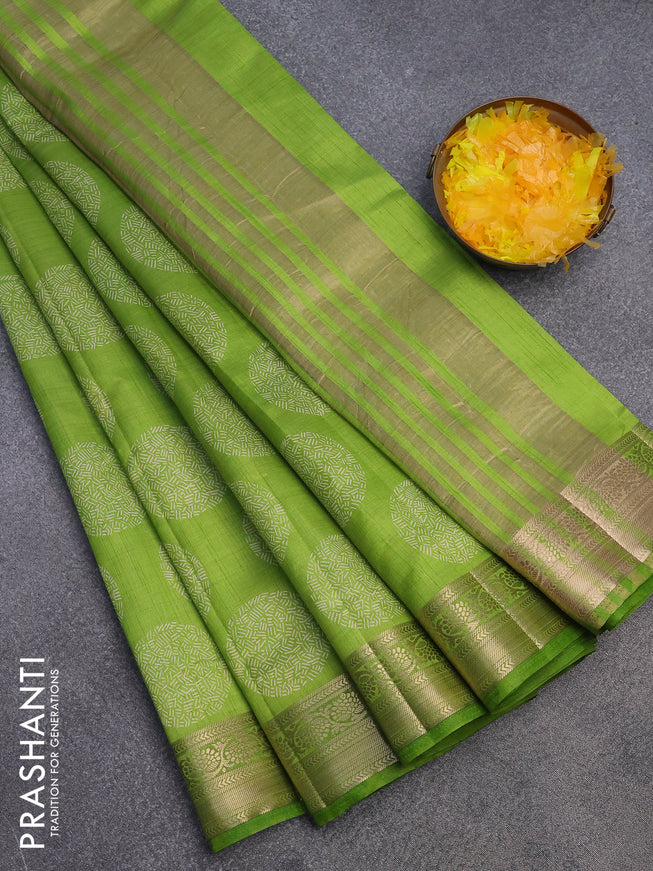 Semi raw silk saree light green with butta prints and zari woven border