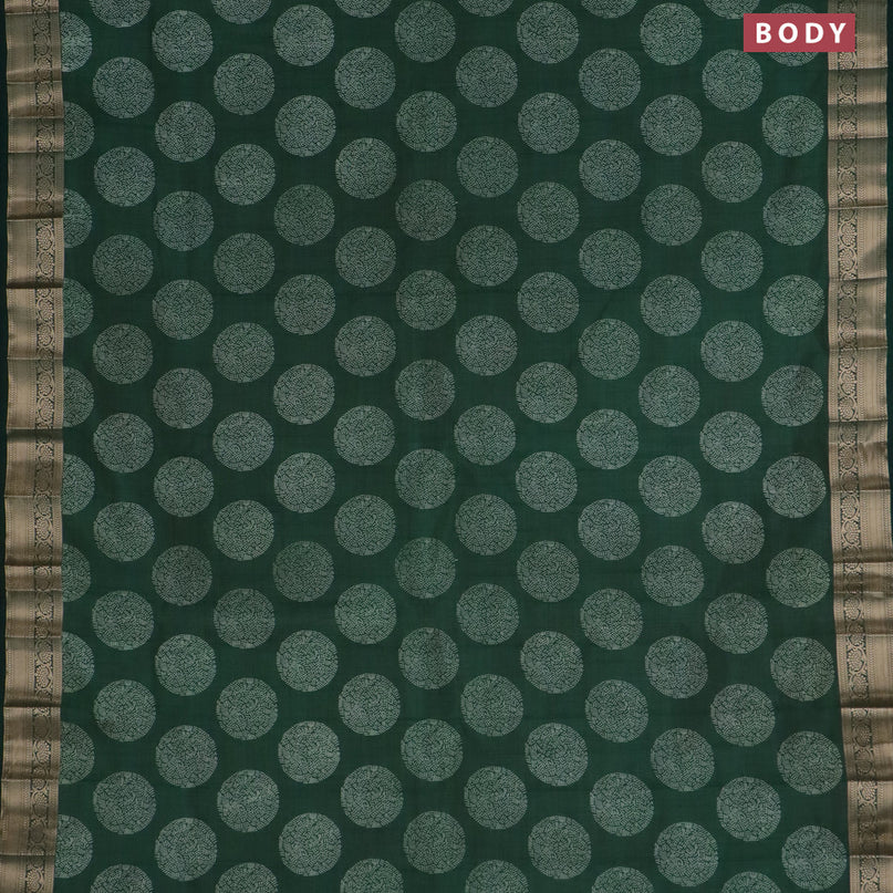 Semi raw silk saree bottle green with butta prints and zari woven border