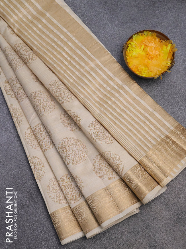 Semi raw silk saree cream with butta prints and zari woven border