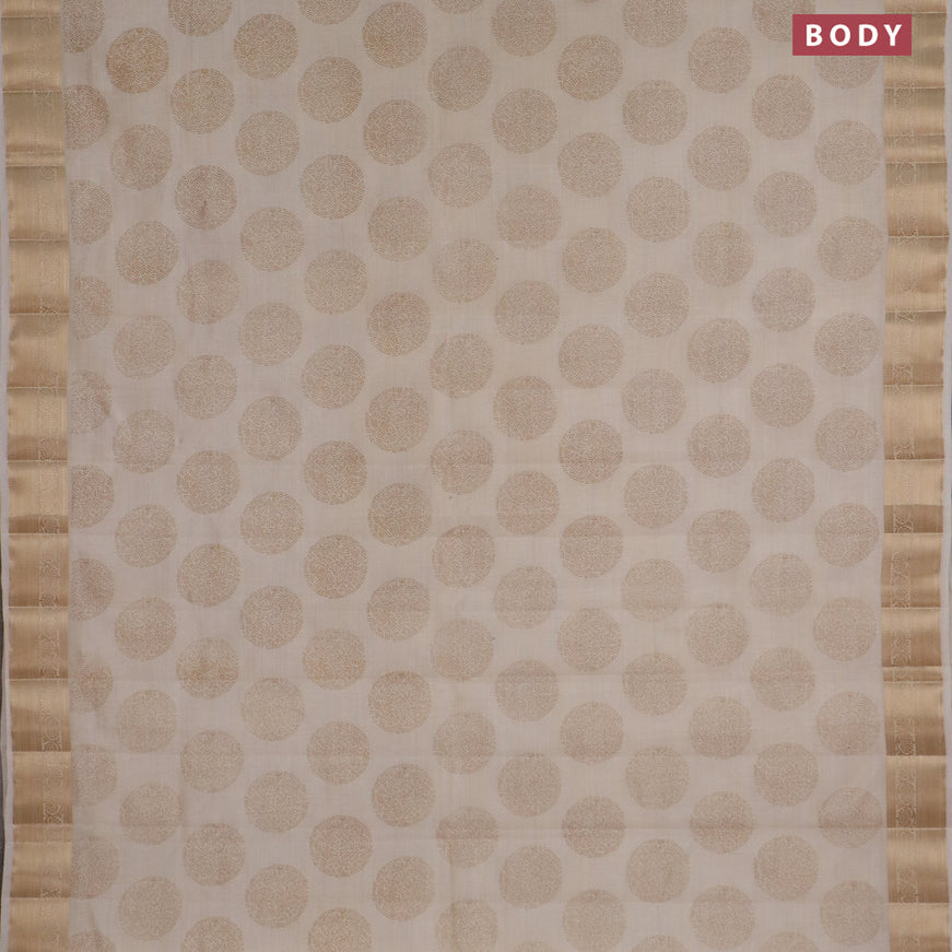 Semi raw silk saree cream with butta prints and zari woven border