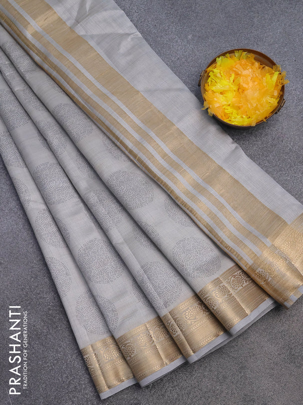 Semi raw silk saree pastel grey with butta prints and zari woven border