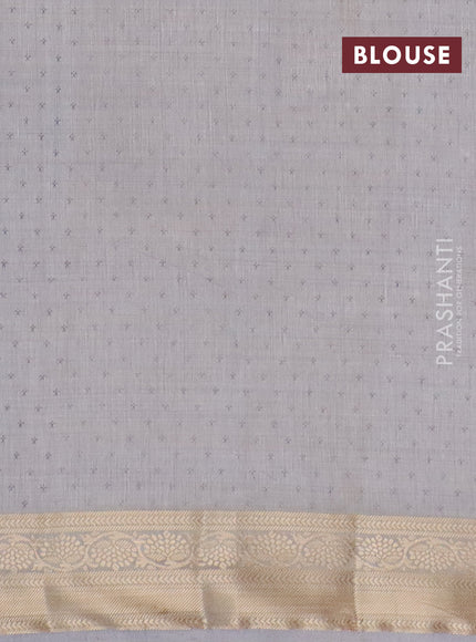 Semi raw silk saree pastel grey with butta prints and zari woven border