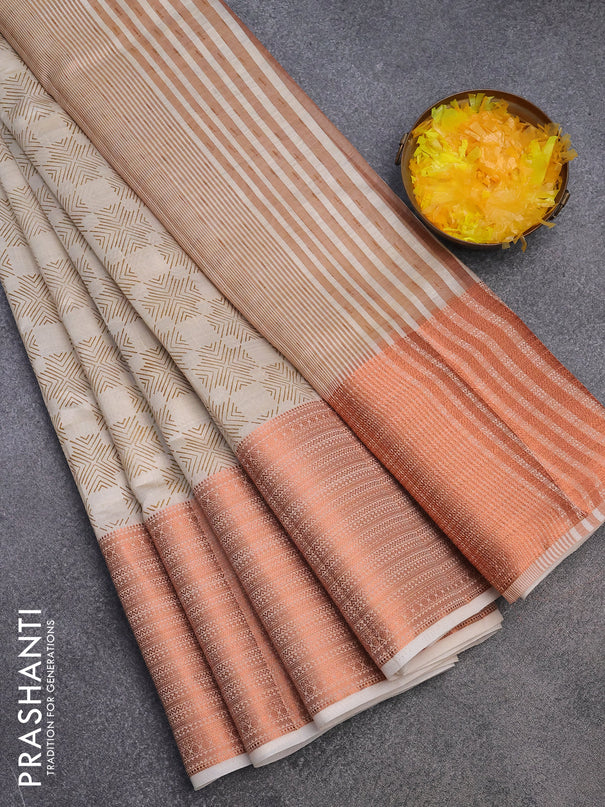 Semi raw silk saree cream with allover butta prints and long copper zari woven border