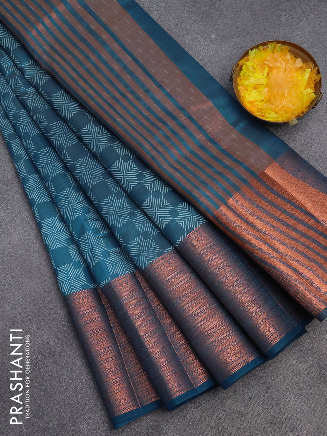 Semi raw silk saree cs blue with allover butta prints and long copper zari woven border