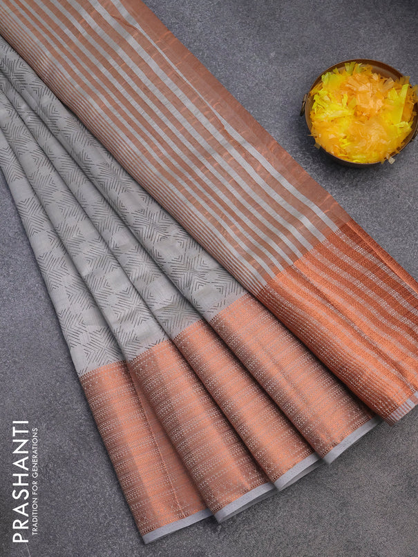 Semi raw silk saree pastel grey with allover butta prints and long copper zari woven border