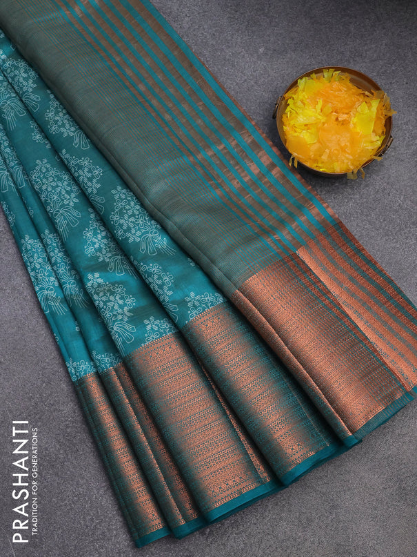 Semi raw silk saree teal green shade with allover floral butta prints and long copper zari woven border