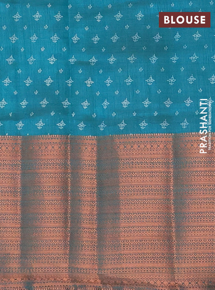 Semi raw silk saree teal green shade with allover floral butta prints and long copper zari woven border