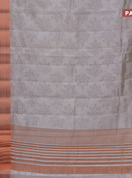 Semi raw silk saree pastel grey with allover floral butta prints and long copper zari woven border