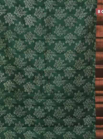 Semi raw silk saree bottle green with allover floral butta prints and long copper zari woven border