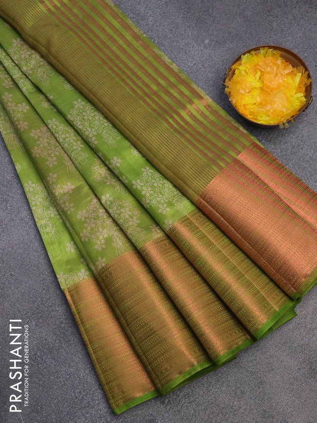 Semi raw silk saree light green with allover floral butta prints and long copper zari woven border