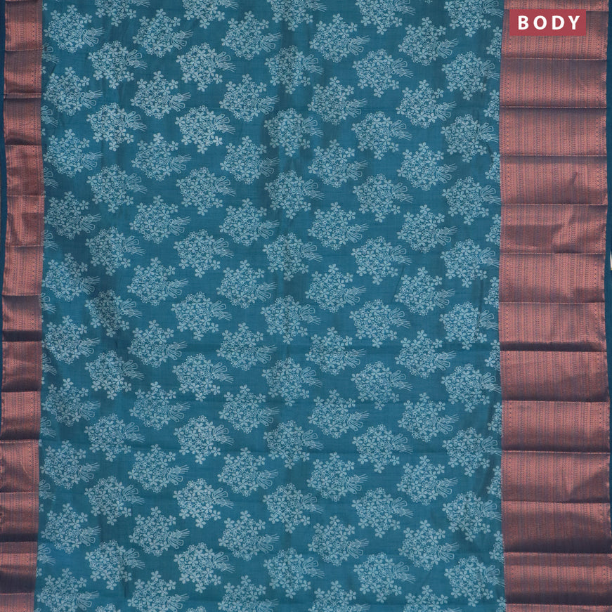 Semi raw silk saree cs blue with allover floral butta prints and long copper zari woven border