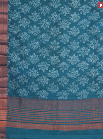 Semi raw silk saree cs blue with allover floral butta prints and long copper zari woven border