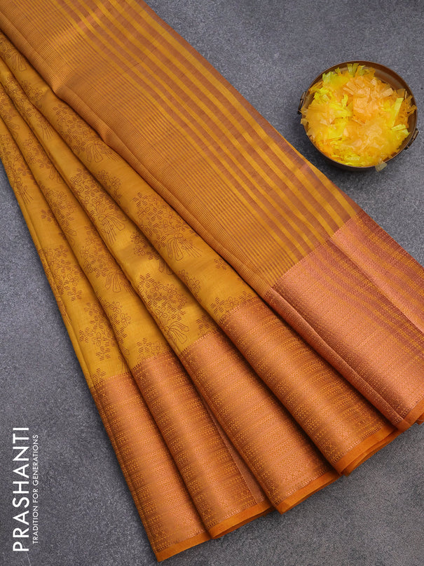 Semi raw silk saree mustard yellow with allover floral butta prints and long copper zari woven border