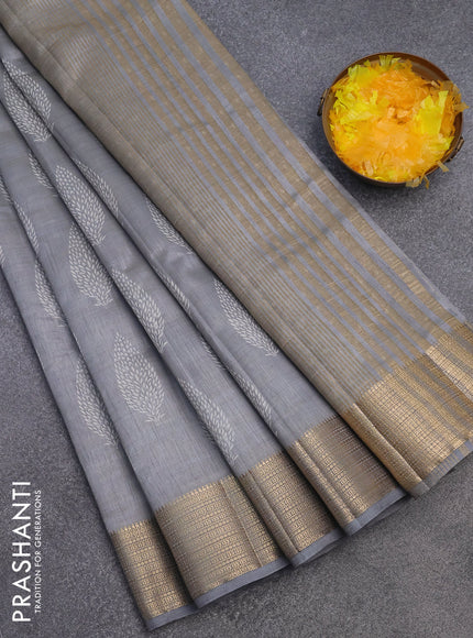 Semi raw silk saree grey with allover leaf prints and zari woven border