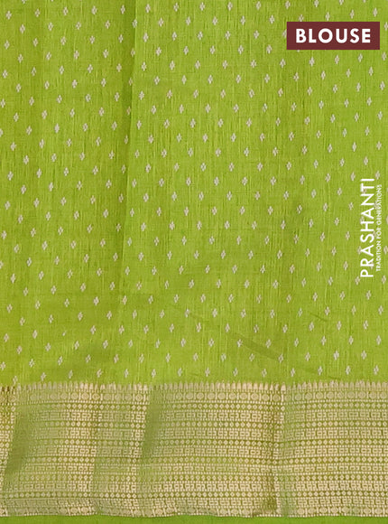 Semi raw silk saree light green with allover leaf prints and zari woven border