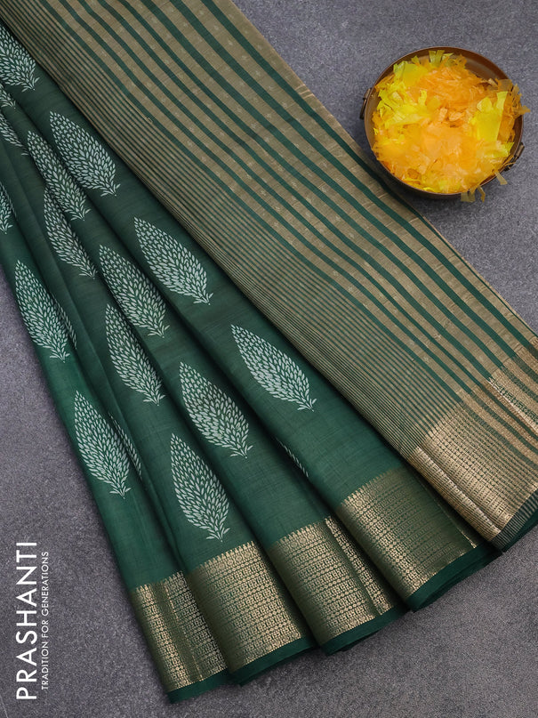 Semi raw silk saree bottle green with allover leaf prints and zari woven border